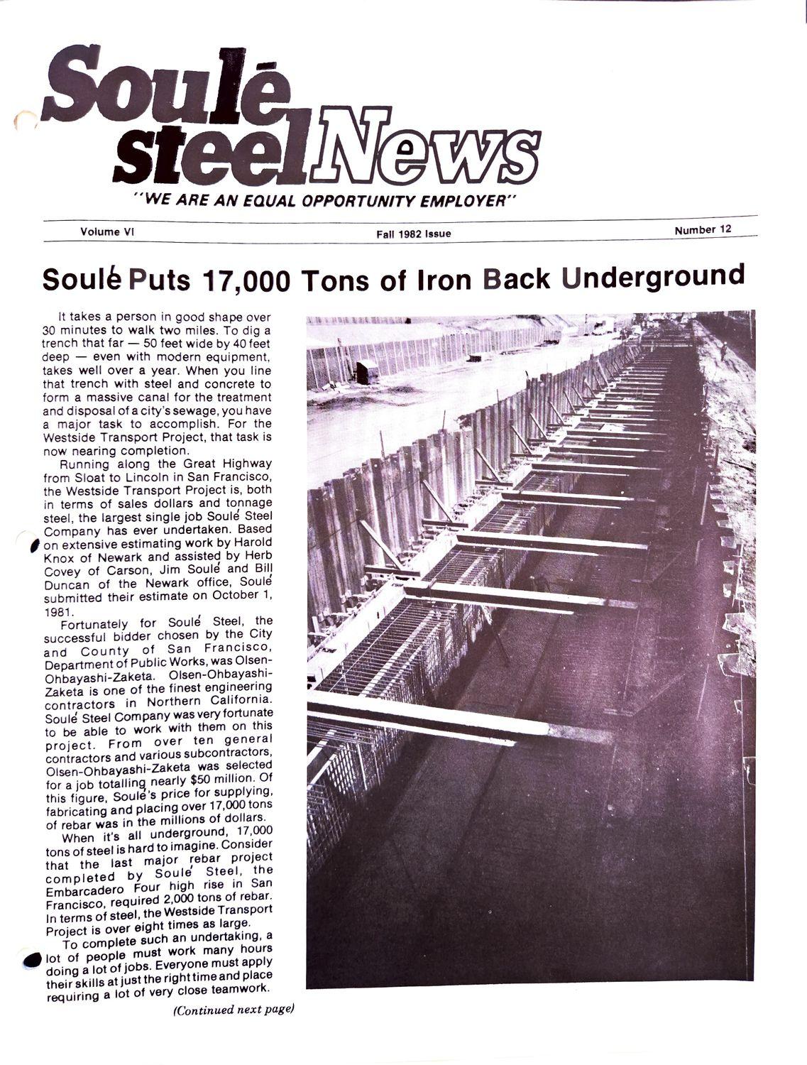 Aerial view of a long concrete trench with steel supports under construction.